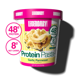 A tub of Legendary Nutrition Protein Pasta+ Garlic Parmesan flavor, shown on a white background with a cast shadow. Two circular graphic callouts on the left highlight 48g protein and 8g net carbs.